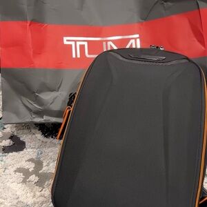 Tumi Black Travel Case with Orange Trim